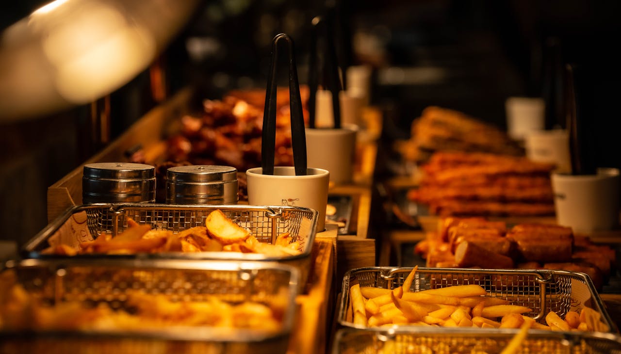 A close-up shot of various fried foods in baskets, perfect for street food lovers.